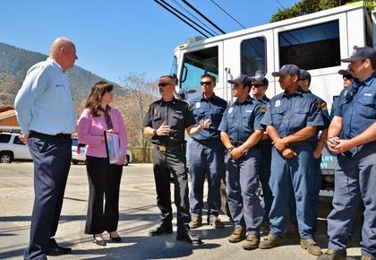 Supervisor Couch and Fire Chief Marshall make presentation of office furniture to Mountain Communities Chamber of Commerce Executive Director Rachel Unell